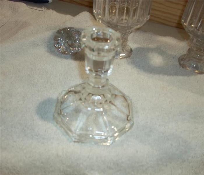 cleaned, shiny glass candlestick holder 