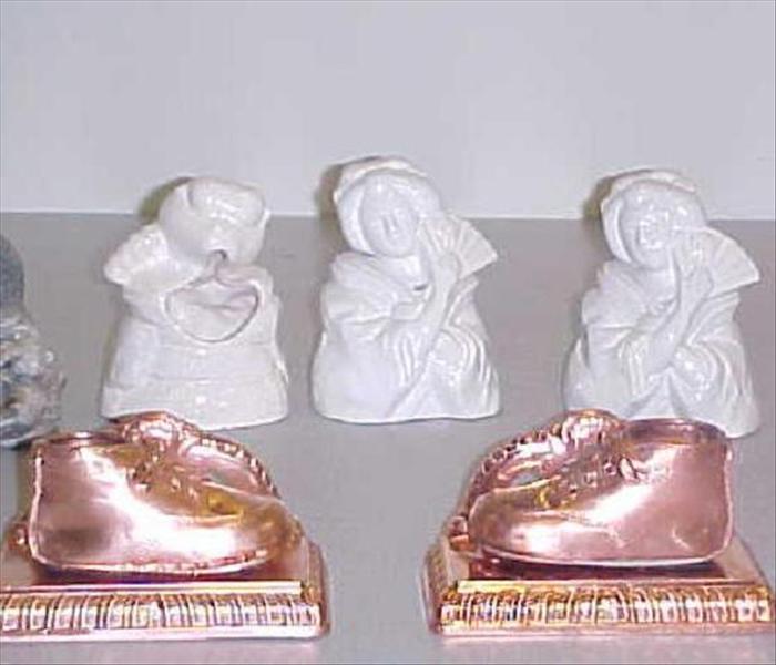 cleaned ceramic figurines and gold plated baby shoes 