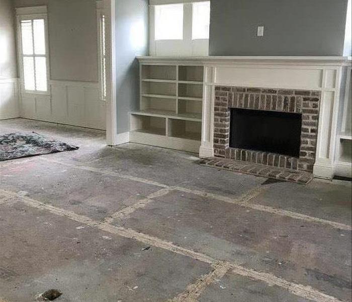 Living room with removed flooring 