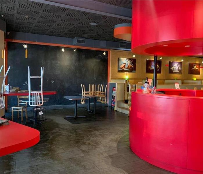 Restaurant dining area with red and black walls 