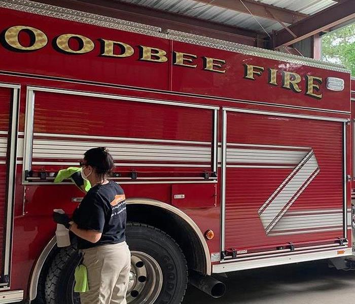 SERVPRO technician cleaning and sanitizing Goodbee fire truck