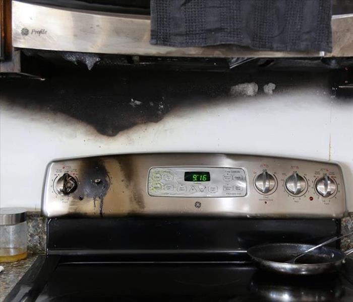 Stovetop covered in soot 