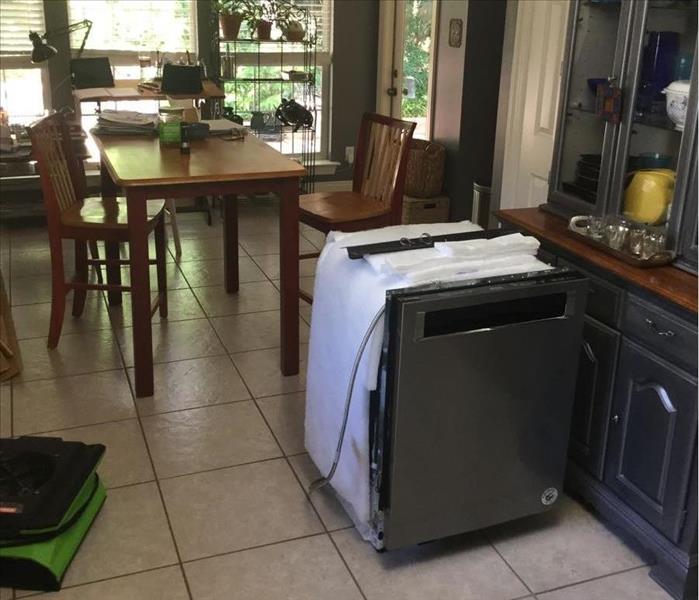 dishwasher in kitchen with green SERVPRO fan