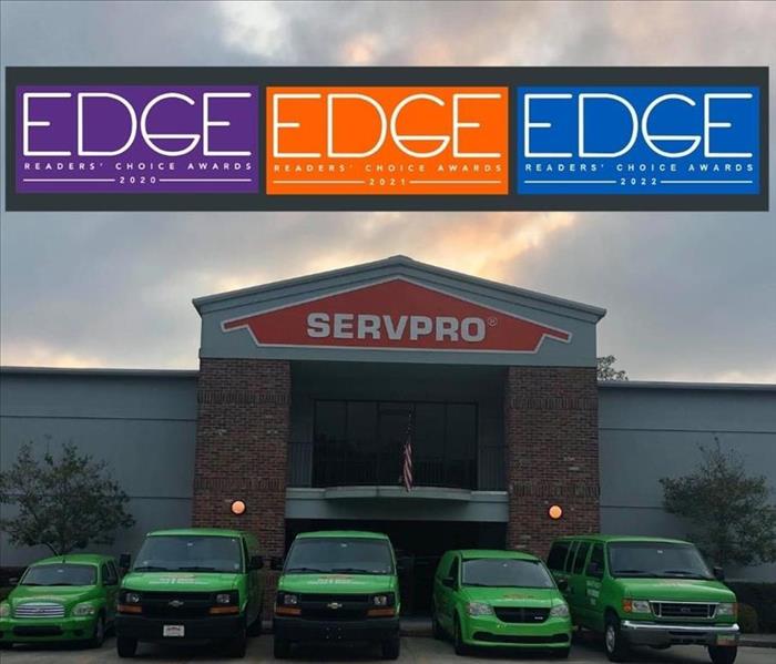 SERVPRO of Greater Covington and Mandeville office and warehouse with green vehicles in front 