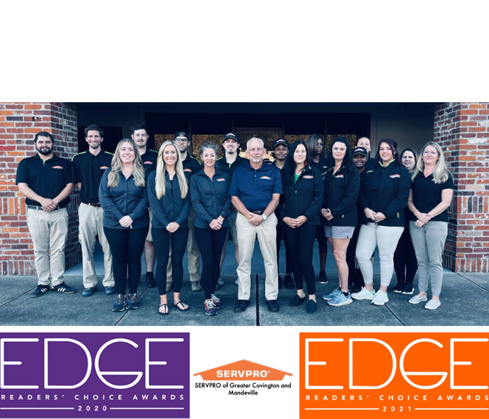 photo of SERVPRO of Greater Covington and Mandeville crew with awards graphics for edge of the lake magazine
